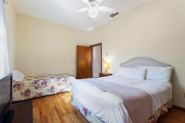 bedroom featuring hardwood / wood-style flooring and ceiling fan