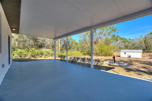 view of patio / terrace featuring a storage shed