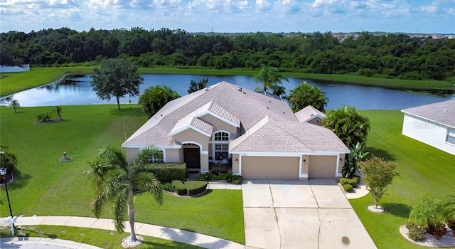 birds eye view of property with a water view