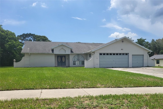 view of front of house featuring a garage and a front yard