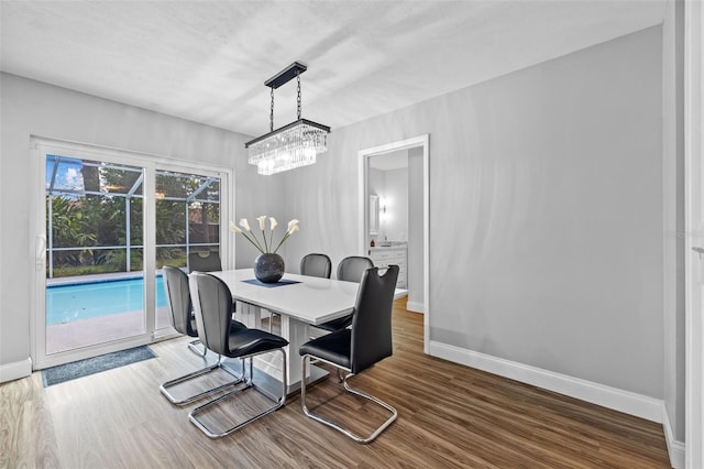 dining space featuring hardwood / wood-style flooring