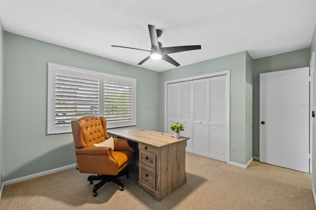 home office featuring ceiling fan and light colored carpet