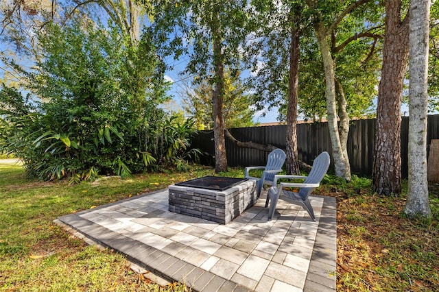 view of patio / terrace featuring a fire pit