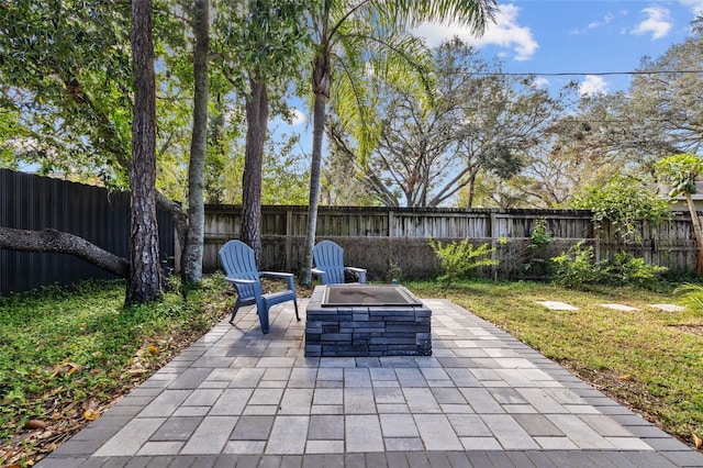 view of patio / terrace featuring a fire pit