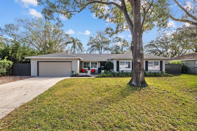 ranch-style house with a garage and a front lawn