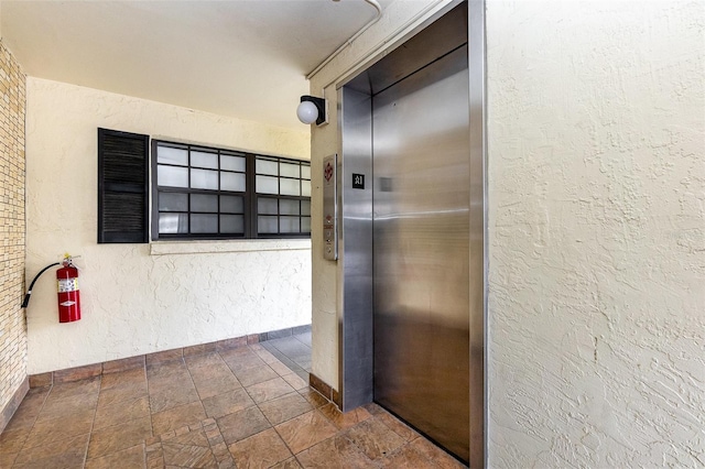 hallway featuring elevator