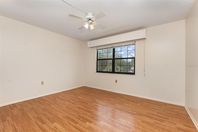 spare room with ceiling fan and light hardwood / wood-style flooring