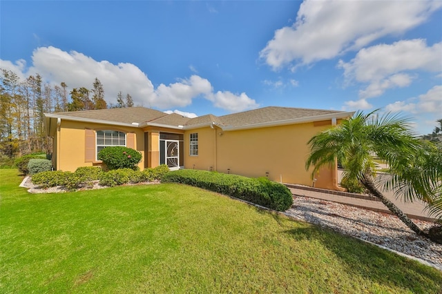 ranch-style home with a front yard