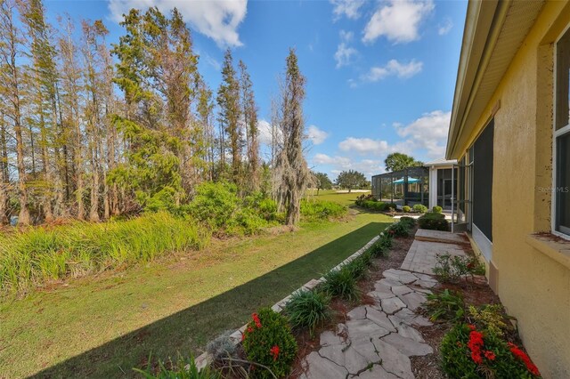 view of yard with a lanai