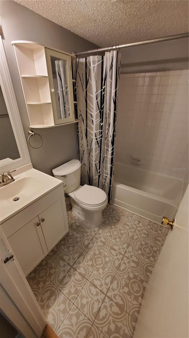 full bathroom featuring shower / bathtub combination with curtain, toilet, vanity, a textured ceiling, and tile patterned floors