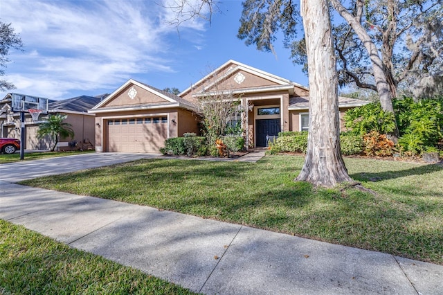 view of front facade with a garage and a front lawn