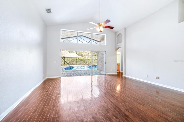 unfurnished living room with ceiling fan, high vaulted ceiling, and dark hardwood / wood-style flooring