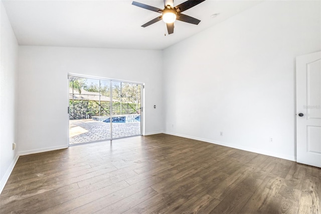 spare room featuring vaulted ceiling, ceiling fan, and dark hardwood / wood-style flooring