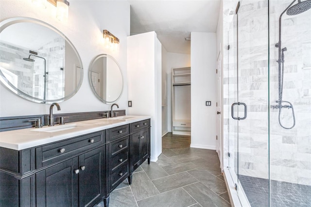 bathroom featuring vanity and a shower with door