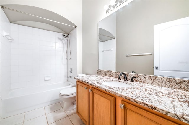 full bathroom with vanity, toilet, tiled shower / bath combo, and tile patterned flooring