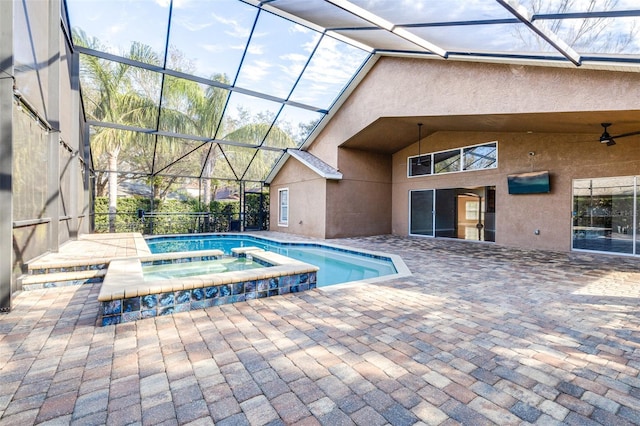 view of pool featuring an in ground hot tub, a lanai, and a patio area