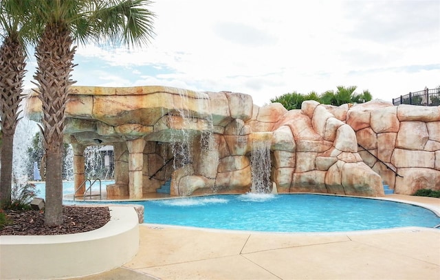 view of pool featuring pool water feature