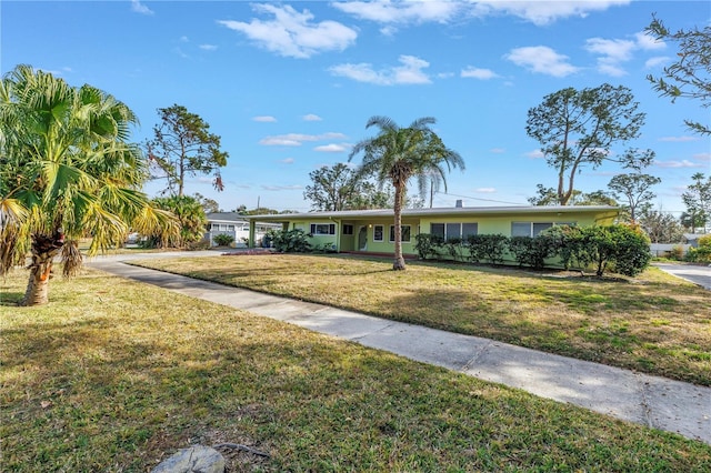 ranch-style home featuring a front yard