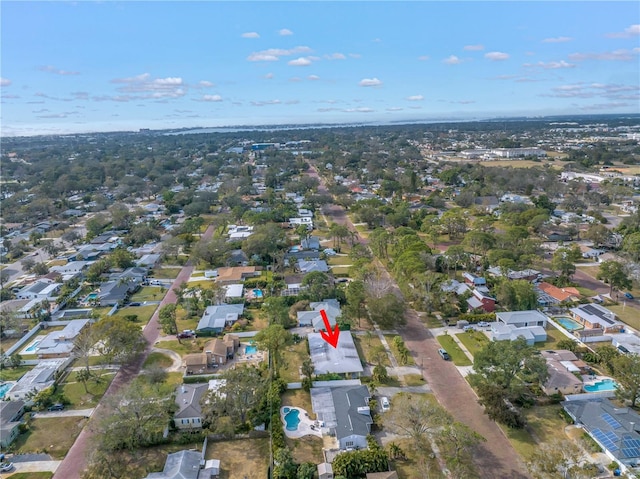 birds eye view of property with a residential view