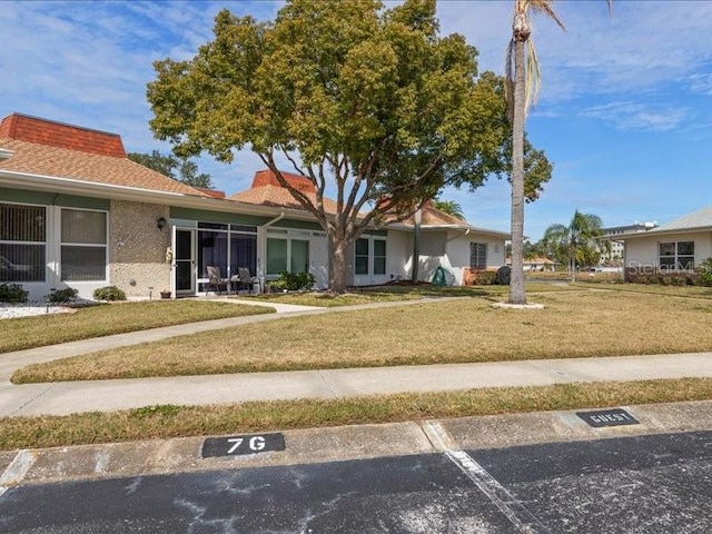 ranch-style house with a front lawn