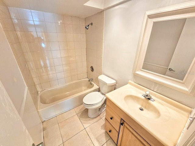 full bathroom with vanity, tile patterned flooring, tiled shower / bath combo, and toilet