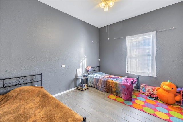 bedroom featuring ceiling fan and light wood-type flooring