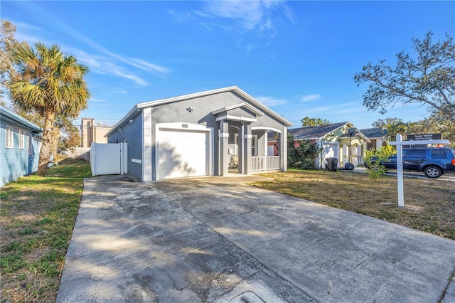 view of front of property with a garage and a front yard