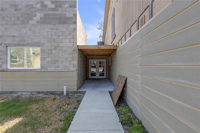 view of exterior entry featuring french doors