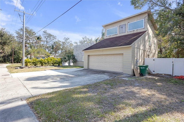 view of property exterior with a garage