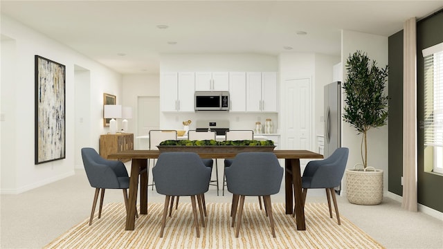 dining room featuring light colored carpet