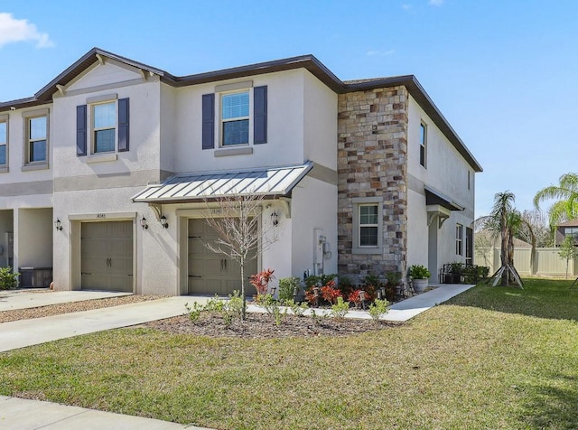 view of front of home with a garage and a front yard