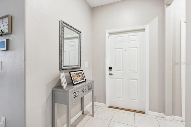 foyer with light tile patterned flooring