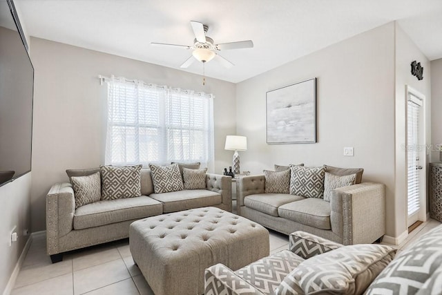 living room featuring ceiling fan and light tile patterned floors