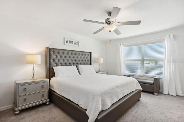 bedroom with light colored carpet and ceiling fan