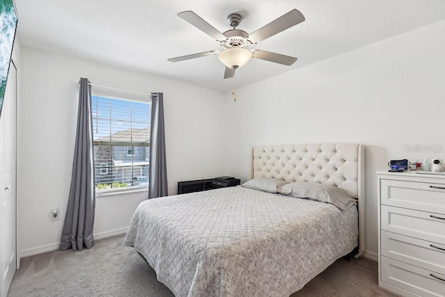 bedroom with light carpet and ceiling fan