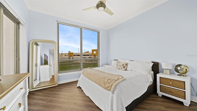 bedroom featuring dark wood-type flooring, ceiling fan, and lofted ceiling