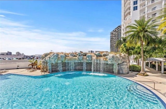 view of pool featuring pool water feature