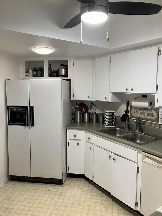 kitchen featuring white cabinetry, sink, ceiling fan, and white appliances