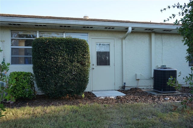 property entrance featuring cooling unit