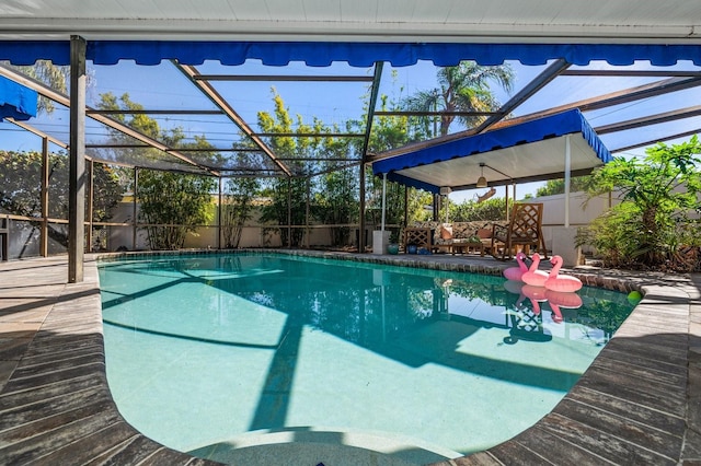 view of swimming pool with a lanai