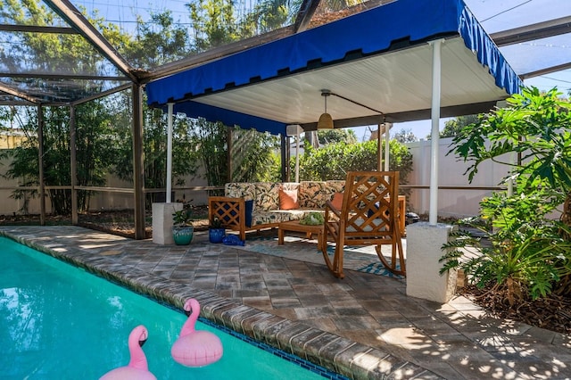 view of pool with a lanai, an outdoor hangout area, and a patio area