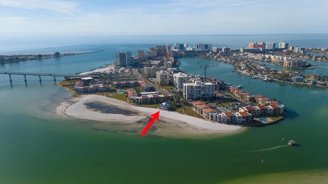 drone / aerial view featuring a water view and a view of the beach