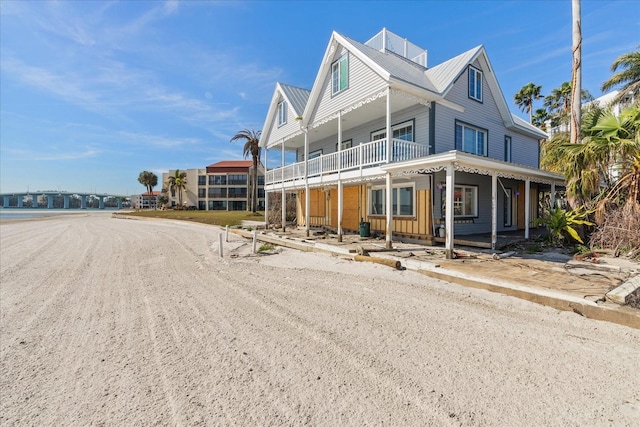 view of front of home featuring a balcony