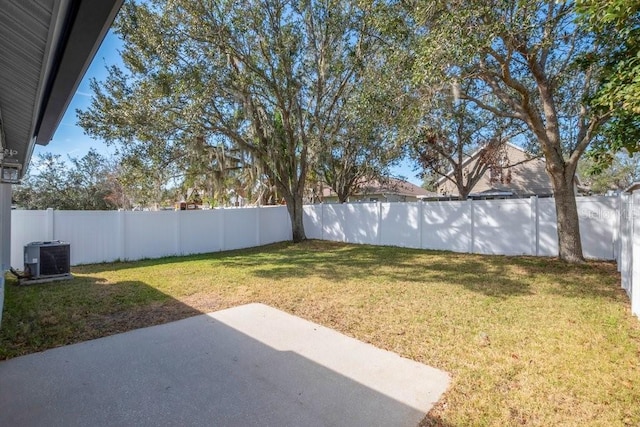 view of yard with a patio and central air condition unit