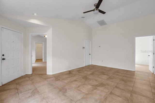 unfurnished room featuring vaulted ceiling and ceiling fan