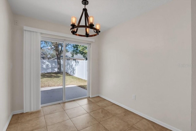 unfurnished dining area with light tile patterned floors and a chandelier