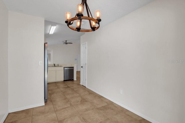 unfurnished dining area with sink, light tile patterned floors, and an inviting chandelier