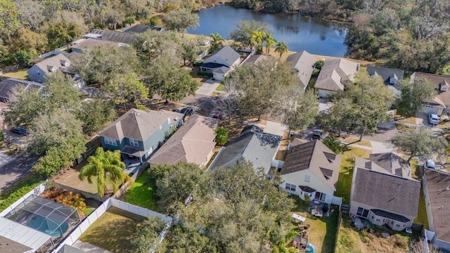 birds eye view of property with a water view