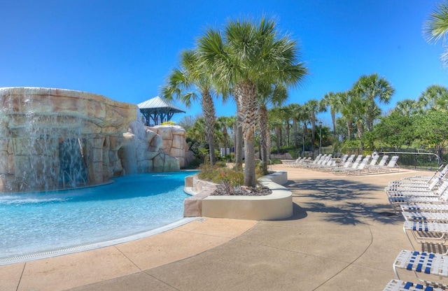 view of pool featuring pool water feature