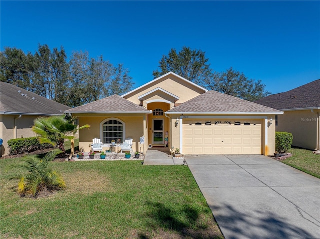 view of front of property featuring a garage and a front lawn